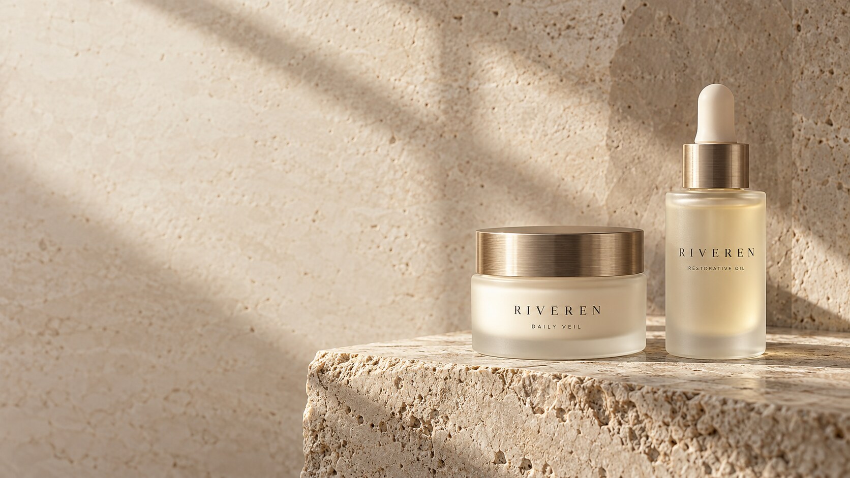 Riveren Daily Veil cream and Restorative Oil in frosted glass on sunlit travertine